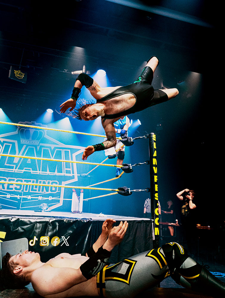Canadian professional wrestler The Back Breaker Dylan Broda jumps on Estonia's Artur Arder in a TLC match 2025 (Tables, Ladders & Chairs).